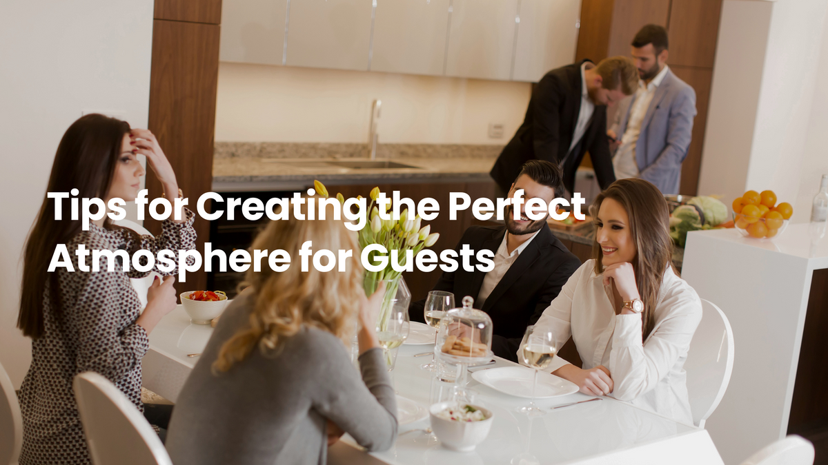 Guests gathered around a modern dining table in a bright kitchen, creating a warm and welcoming atmosphere for entertaining at home.