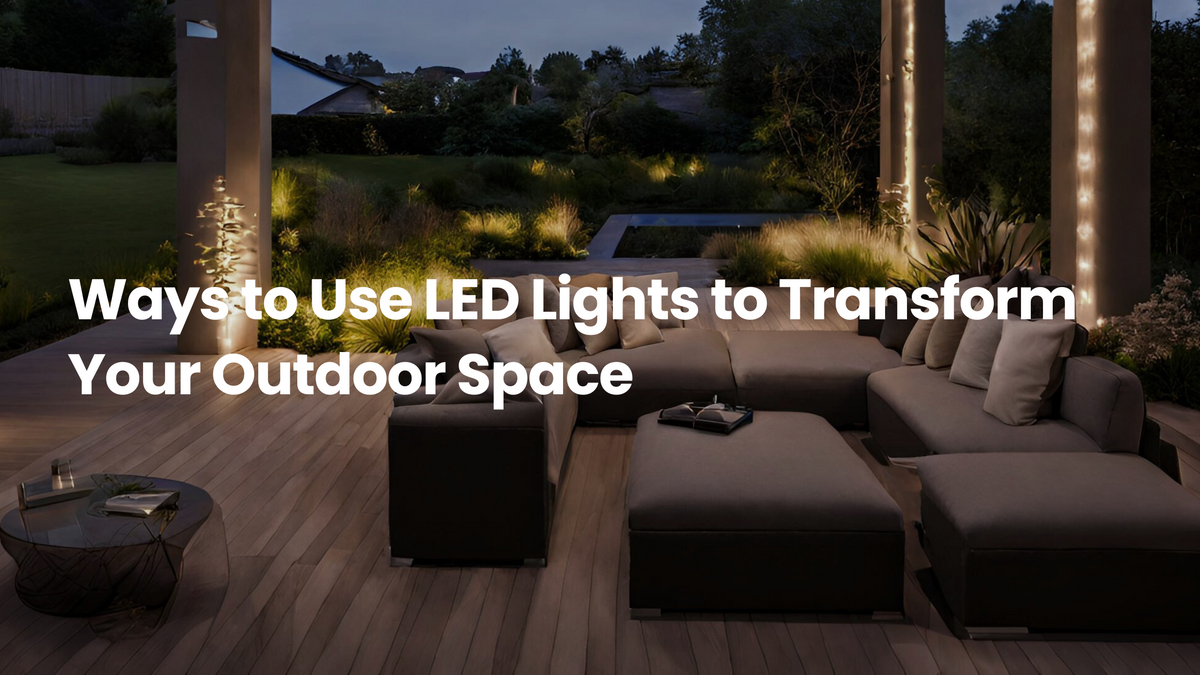 Modern outdoor patio with lounge seating, warm LED accent lighting on columns, and illuminated garden landscaping, showcasing ways LED lights can transform an outdoor living space.
